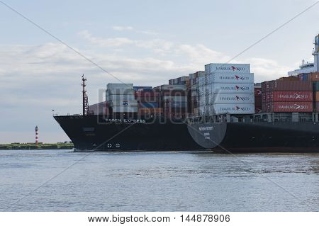 Hamburg, Germany - August 18, 2016: Container ship sails on the Elbe towards Hamburg harbor on August 18, 2016, in the Germany Hamburg
