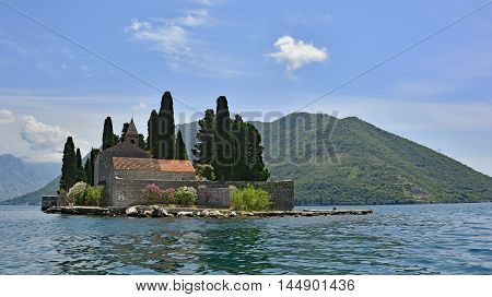 The tiny St George's Island in Kotor Bay Montenegro also known as the Island of the Dead. The island contains a 12th century Benedictine abbey and a cemetery.