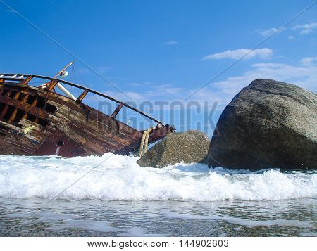 Shipwreck on a beach after a storm.