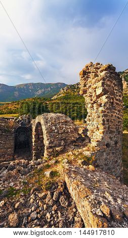 Landscape of the ruins of the fortress at sunset. (Funa)