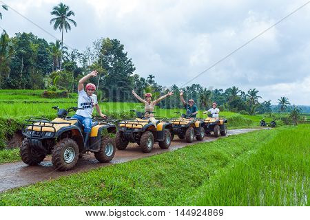 Bali Island, Indonesia - August 25, 2008: Group Of Tourists Driving Quadrocycle Safari