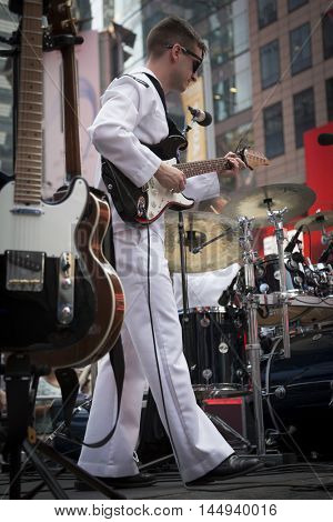 NEW YORK MAY 27 2016: Navy Band Northeast Rhode Island Sound perform a public concert on Military Island Pedestrian Plaza in Times Square during Fleet Week 2016 in Manhattan.