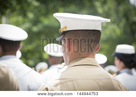 NEW YORK MAY 27 2016: Participating Marine Corps personnel stand at attention at the re-enlistment and promotion ceremony at the National September 11 Memorial site during Fleet Week 2016.