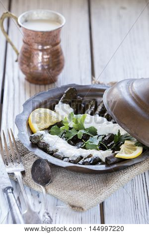 turkish dolmades with natural light on wooden table
