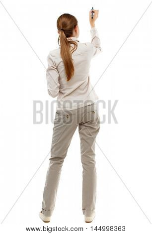 back view of writing beautiful woman. Isolated over white background. Skinny girl in white denim suit is writing on the blackboard.
