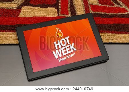 Tablet Over The Table With Hot Week Advertising On The Screen. Marketing, E-commerce, Publicity.