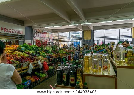Montenegro, Budva - June 05/2017: Tourists Make Their Purchases In The Central City Market.
