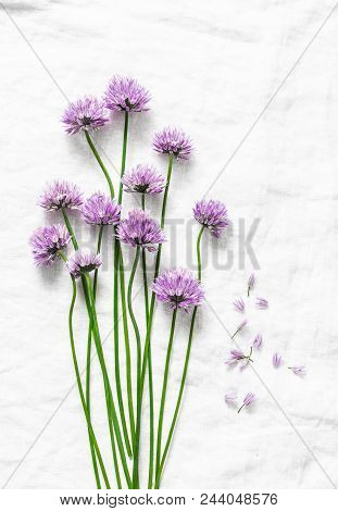 Food Background With Free Space For Text. Schnitt-onion, Chives Flowers On White Background, Top Vie