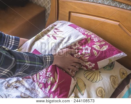 Close Up Hands Whip Pillow In The Bed At Home