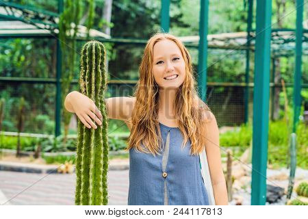 A Woman Hugs A Cactus As Her Best Friend. Problems Of Friendship Concept.