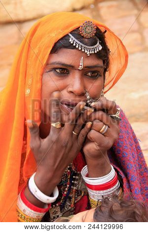 Jaisalmer, India - February 14: Unidentified Woma Plays On Mouth Harp In Jaislamer Fort On February 