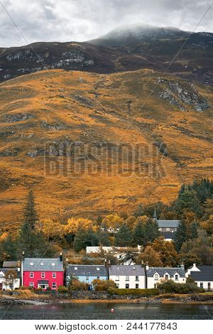 The colourful houses of Dornie in autumn, on the banks of Loch Long, Loch Alsh and Loch Duich, Ross Shire, the Highlands of Scotland, UK