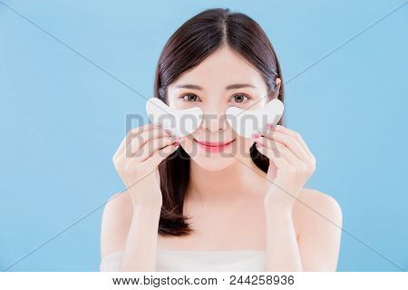 Beauty Skincare Woman Smile Happily And Take Eye Mask On The Blue Background