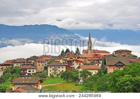 Scenic View Of Mountain Village In Italian Alps