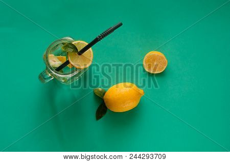 Emon Detox-cocktail In A Glass Jar On Mint  Background. Concept Of Healthy Drinks, Copy Space, Close