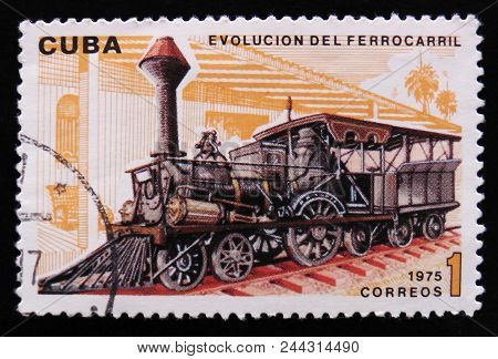 Moscow, Russia - April 2, 2017: A Post Stamp Printed In Cuba Shows Moving Train And Devoted Evolutio