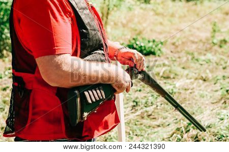 Hunter Charges Shotgun Weapon Shooting Two Cartridges