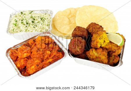 Chicken Curry Take Away Meal With Rice And Poppadoms In Foil Containers Isolated On A White Backgrou