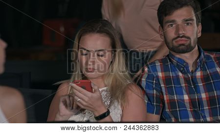 People Comes In Concert Hall Sits In Chairs, Experiencing Different