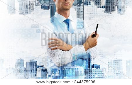 Confident And Young Businessman In Smart-casual Wear Smoking Pipe And Modern Cityscape With Business