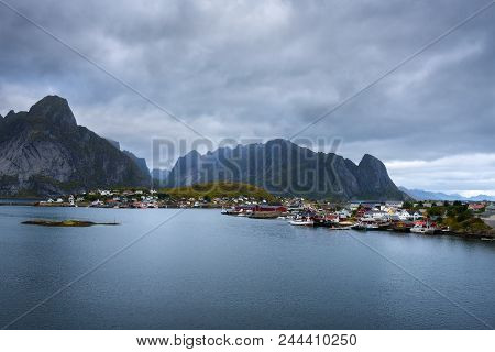 Mount Olstind And Reine Fishing Village On Lofoten Islands In Norway.