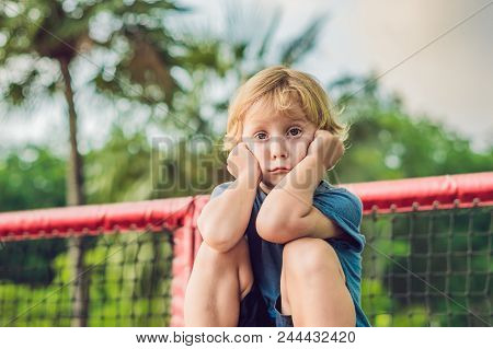 Adorable Little Toddler Boy Having Fun On Playground.