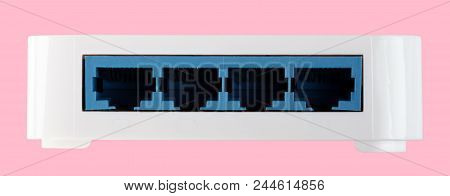 White 8 Port Plastic Ethernet Switch Isolated On Pink Background At Dry Day