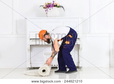 Relocating Concept. Courier Delivers Furniture In Case Of Move Out, Relocation. Man With Beard, Work