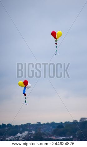 Two Strings Of Balloons Carrying Messages Across The English Channel