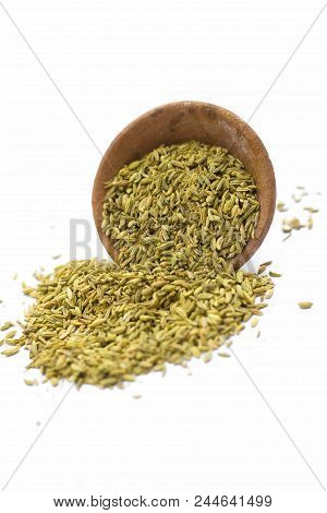 Raw Dried Fennel Seeds In A Clay Bowl Isolated On White.