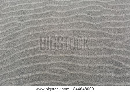 Windswept Sand Dune Wavy Lines Pattern On Sandy Beach Background