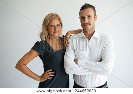 Confident Company Cofounders Standing And Looking At Camera. Content Successful Businesswoman Leanin