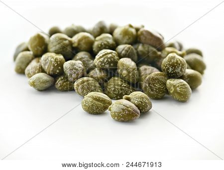 Capers On A Isolated White Background, Selective Focus