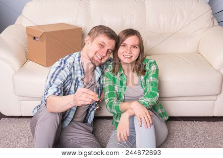 Beautiful Family With Boxes And Holding Flat Keys