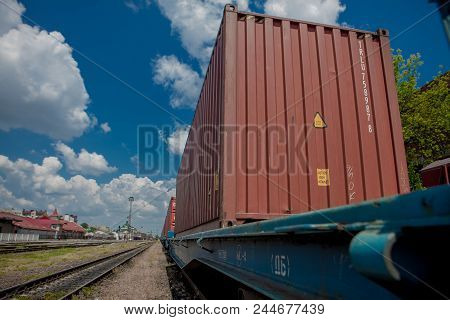 Container Loaded On Train Wagons On A Railway.
