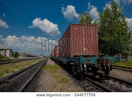 Container Loaded On Train Wagons On A Railway.