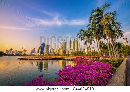 Bangkok, Thailand - March 30, 2018 : Lake Ratchada Situated In The Benjakitti Park With Flowers In T