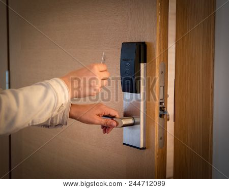 Opening A Hotel Door With Keyless Entry Card.