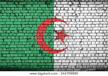Algeria Flag Is Painted Onto An Old Brick Wall