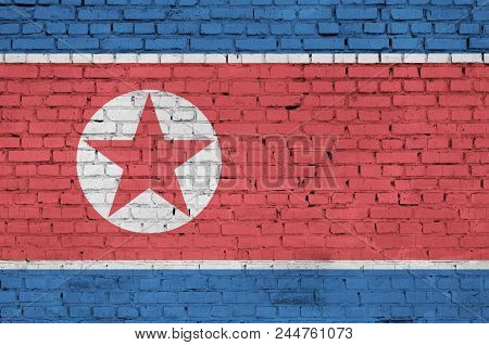 North Korea Flag Is Painted Onto An Old Brick Wall