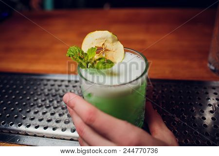 Bartender Hand Prepares A One Cocktail Ice