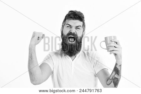 Man With Happy Face Stretching Try To Awake With Cup Of Coffee. Hipster With Beard Holds Mug, Energe