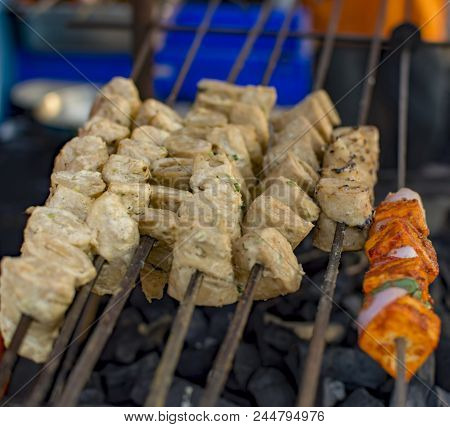 Soya Tikka And Cheese Kebabs On Steak On Charcoal