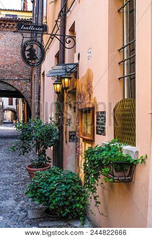 Ferrara, Italy - June, 9, 2018: restaurant in the old town of Ferrara, Italy