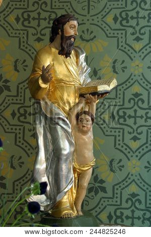 ZACRETJE, CROATIA - AUGUST 06: Saint Matthew the Evangelist, statue on the Sacred Heart of Jesus altar in the Parish Church Exaltation of the Holy Cross in Zacretje, Croatia on August 06, 2017.