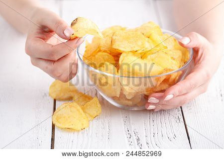Big Dish Fulll Of Potato Vhips And Female Take One