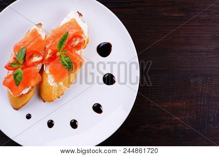 Appetizing Crunchy Italian Bruschettas With Salmon. Restaurant Seafood Menu Photo, Traditional Cuisi