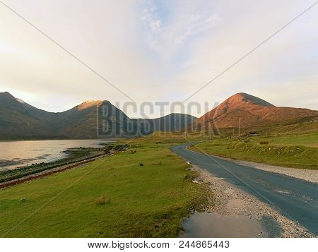 View Over  Autumnal Orange Bare Landscape, Sinle Road,  Meanders, High  Rocky Hills And Past Pasture