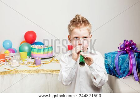 Lovely Boy Is Celebraiting Birthday Party With Cake And Presents