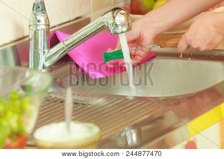 Household. Closeup Woman Doing The Washing Up In Kitchen